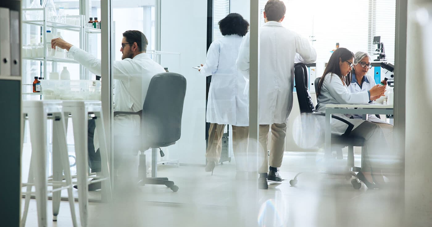 Researcher at the microscope in the AetherBio+ lab